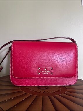 kate spade red leather crossbody with gold logo plate